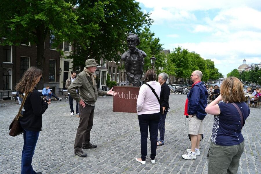 Amsterdam: The Story of History & Culture Walking Tour - Historic buildings, canals, and details worth stopping for