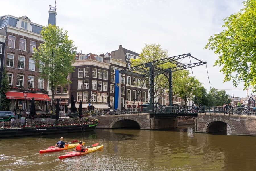 Amsterdam: Walking Tour with Dutch Pancake Lunch - Pace, language, weather, and timing