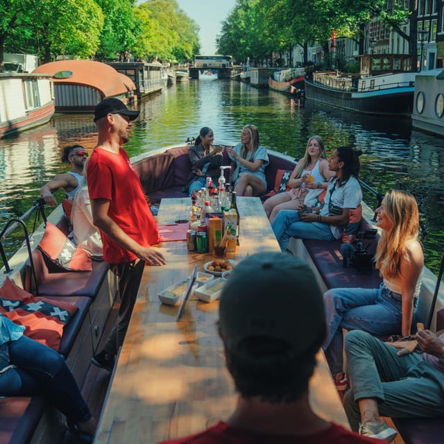 COZY AND FUN CANAL TOUR: A UNIQUE JOURNEY THROUGH AMSTERDAM - NEMO Science Museum and Het Scheepvaartmuseum