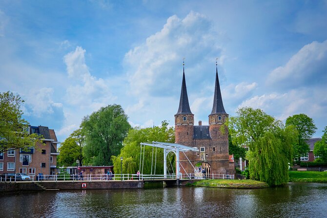 Delft: City Walk with Audio Guide in 7 Languages on your Phone - The leaning Oude Kerk and Delft’s unusual details