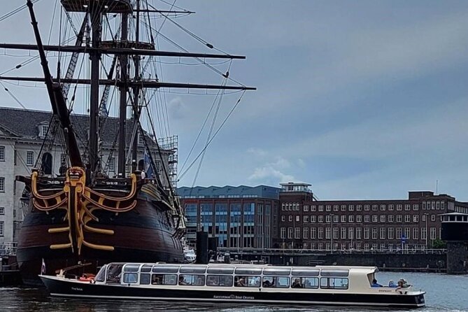 Discover Amsterdam: Luxury Canal Cruise with a Local Skipper - Historic buildings, dancing houses, and canal views