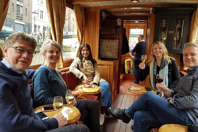 Eating Amsterdam: Food Tour & Canals Cruise - The wooden saloon boat changes the pace