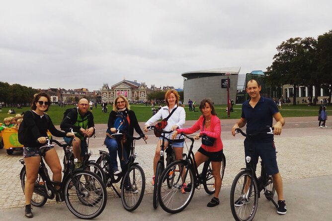Explore Amsterdam by Bike in the Company of a French Local Guide - Begijnhof, Entrepotdok, and the western canal belt