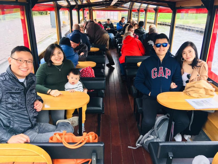Giethoorn: Private Day Trip with Boat Tour from Amsterdam - Walking through Giethoorn’s canal village