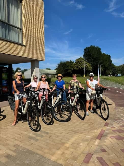 Goes: Full-Day E-Bike Rental - Riding toward the Oosterschelde