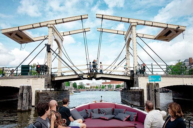 Guided Amsterdam Canal Cruise – Snacks & Drinks on board(1 Hour) - Maritime power beside the replica ship