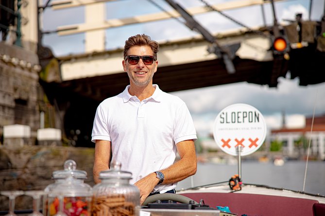 Guided Amsterdam Canal Cruise – Snacks & Drinks on board(1 Hour) - NEMO and a rooftop view across the water