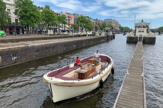 Guided Amsterdam Canal Cruise – Snacks & Drinks on board(1 Hour) - Oude Kerk and the quiet heart of the Red Light District