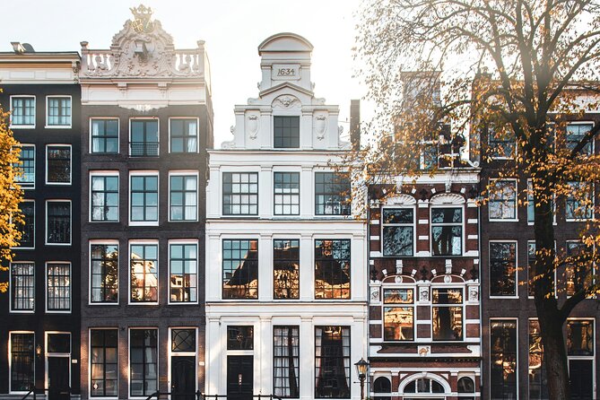 Personalized Hidden Gems of Amsterdam Private Tour with a Local - Old buildings, dancing houses, and St. Nicolas Basilica