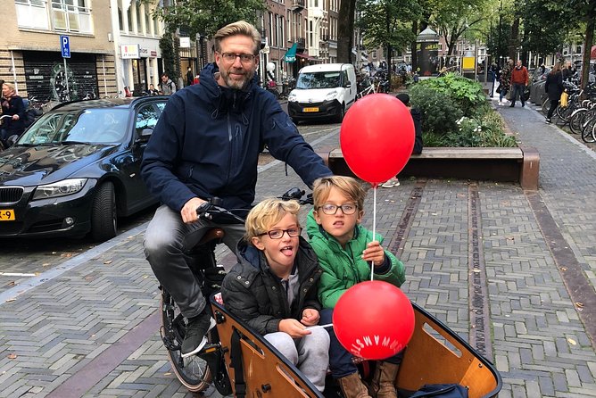 Private Amsterdam Bike Tour with a local guide (also for families) - Dam Square and Damstraat: where the city began