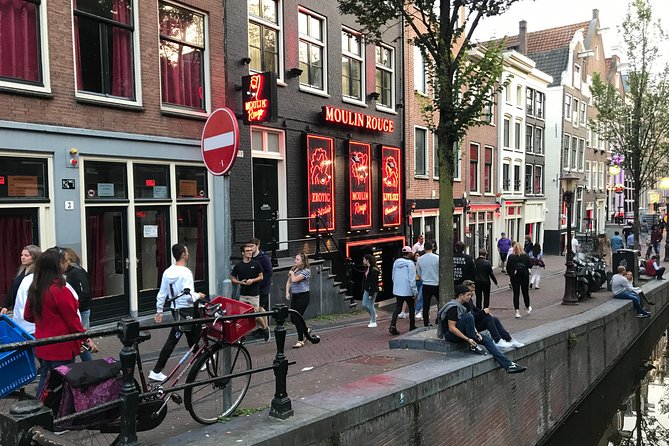 Private Amsterdam Red Light District and Coffee Shop Tour - The smallest house and the pressure of city space