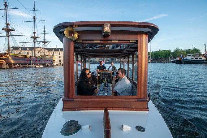 Private Boat Tour Amsterdam - 90 Min incl. welcome drink on historic saloon boat - A classic boat gives Amsterdam a different look