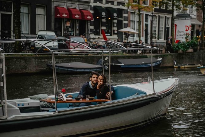 Private Romantic Canal Cruise Amsterdam with Bubbly and Snacks - Houseboats, inner canals, and the smallest house