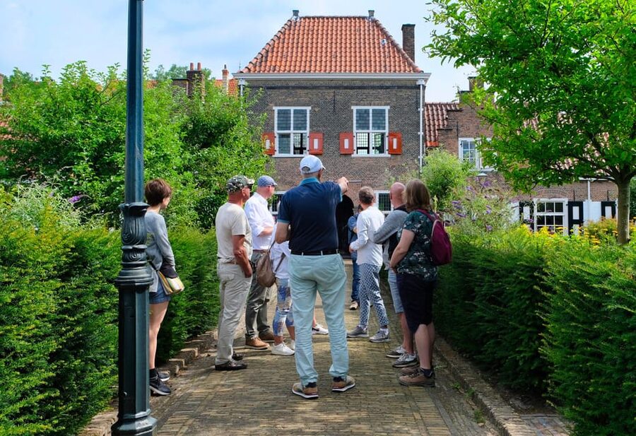The Hague: Courtyard Walking Tour - Entering the old charity courtyards