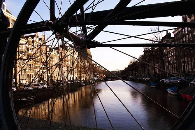 Urban Adventures Amsterdam Bike Tour, Graffiti and Magnet Fishing - Pontsteiger and the ferry shift the view