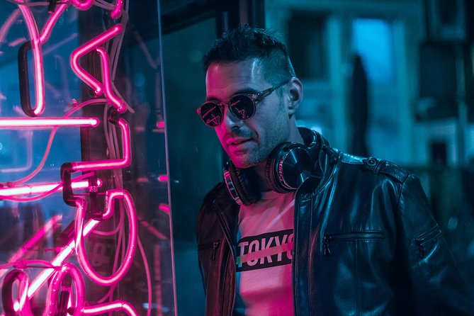 Vacation Night Photoshoot & Tour in Amsterdam - Walking through Amsterdam’s neon streets