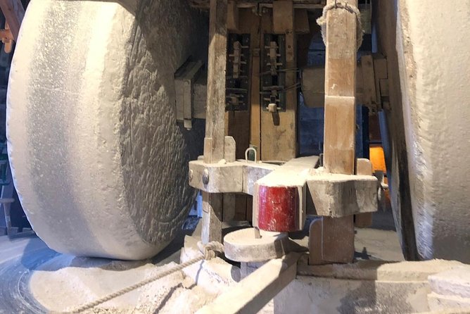 Zaanse Schans Windmills, cheese and clogs and Volendam tour from Amsterdam - Watching a Dutch clog take shape